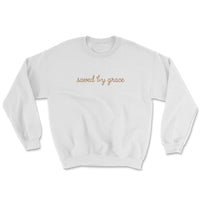Light-colored sweatshirt with “Saved by Grace” text on front and full Ephesians 2:8 verse on back