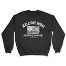Black sweatshirt with 'Welcome Home' text and American flag design on a white background