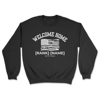 Black sweatshirt with 'Welcome Home' text and American flag design on a white background